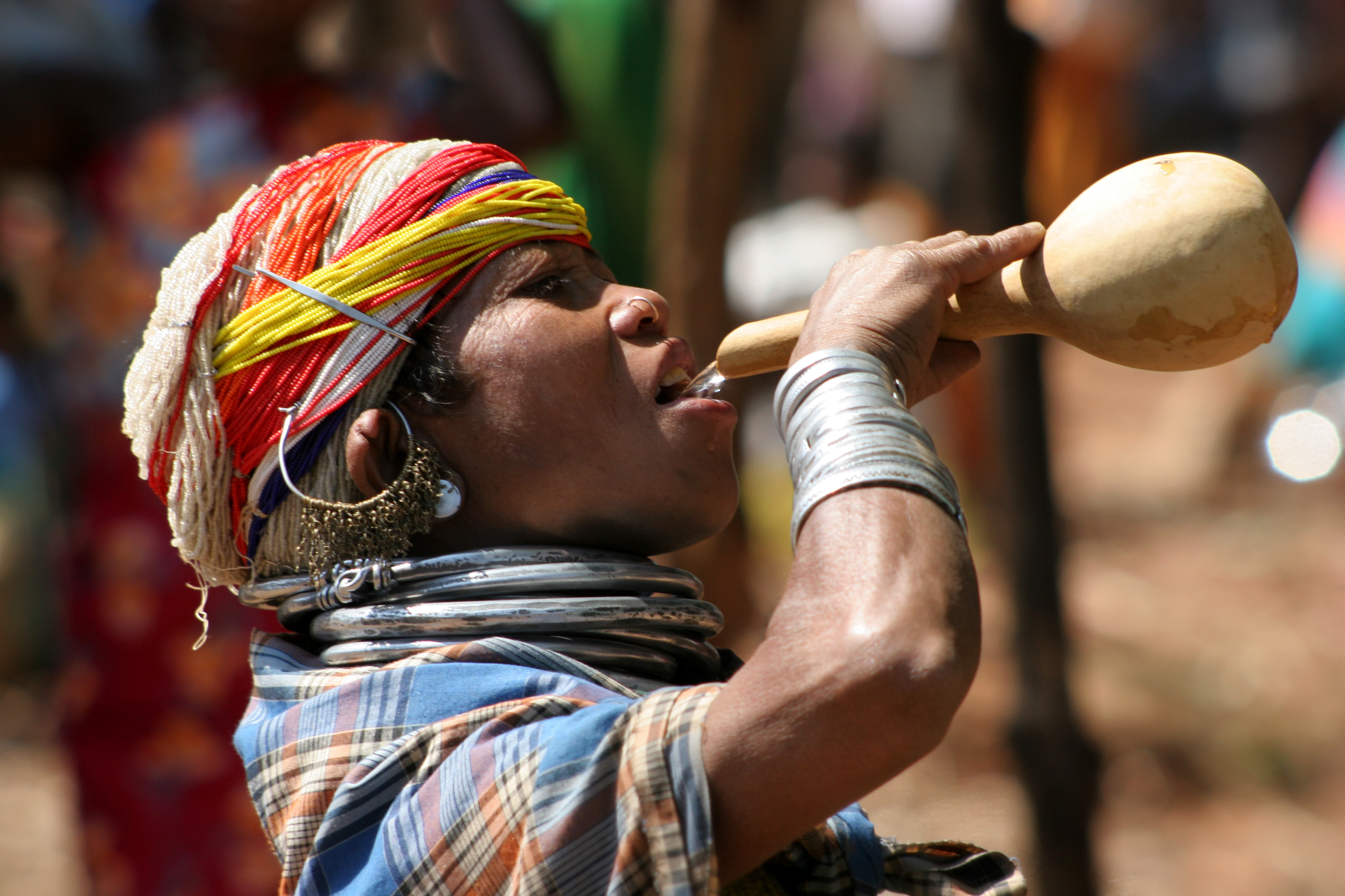 A Bonda tribeswoman drinking rice wine.