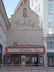 Plaza Theatre in El Paso with a colorful marquee and signs for Broadway and Take the Money and Run